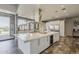 Gourmet kitchen includes large island, stainless steel appliances, and bar seating with outdoor access at 15217 N 15Th Dr, Phoenix, AZ 85023