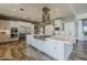 Bright, spacious kitchen with large island, stainless appliances, and range hood at 15217 N 15Th Dr, Phoenix, AZ 85023