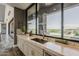 Modern kitchen with a view, featuring light stone countertops and a stainless steel faucet at 15217 N 15Th Dr, Phoenix, AZ 85023