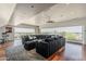 Open living room featuring a large sectional sofa, recessed lighting, and beautiful neighborhood views at 15217 N 15Th Dr, Phoenix, AZ 85023