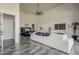 A luxurious living room flows into the main bedroom, with a comfortable seating area and modern decor at 15217 N 15Th Dr, Phoenix, AZ 85023