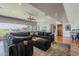 Spacious living room with large sectional sofa, recessed lighting, and wood flooring at 15217 N 15Th Dr, Phoenix, AZ 85023