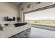 Living room boasts a large glass sliding door that leads to backyard views and lush green grass at 15217 N 15Th Dr, Phoenix, AZ 85023