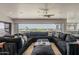 Expansive living room featuring a large sectional sofa and picturesque views from the expansive window at 15217 N 15Th Dr, Phoenix, AZ 85023