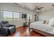 Spacious main bedroom with stunning views and a comfortable seating area at 15217 N 15Th Dr, Phoenix, AZ 85023