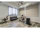 Bright and airy office with large windows, modern furniture, and wood-look tile flooring at 15217 N 15Th Dr, Phoenix, AZ 85023