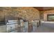 Stainless steel outdoor kitchen featuring a grill, sink, storage, and prep area at 15217 N 15Th Dr, Phoenix, AZ 85023