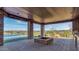Expansive outdoor living area featuring a stone fire pit with an unobstructed view of the city and mountains beyond at 15217 N 15Th Dr, Phoenix, AZ 85023