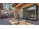 Outdoor patio area has a beautifully designed brick ground cover and is surrounded by stone walls at 15217 N 15Th Dr, Phoenix, AZ 85023