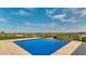 Inviting pool featuring an infinity edge with amazing, unobstructed views of the city and mountains beyond at 15217 N 15Th Dr, Phoenix, AZ 85023