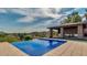 Inviting pool with views, and a covered outdoor kitchen featuring a grill, cabinets and sink at 15217 N 15Th Dr, Phoenix, AZ 85023
