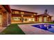 Gorgeous stone home showcasing a pool and outdoor living space at 15217 N 15Th Dr, Phoenix, AZ 85023
