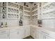 Cozy wine room with custom cabinets and mosaic tile backsplash and bright countertop at 15217 N 15Th Dr, Phoenix, AZ 85023