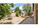 Large backyard featuring beautiful landscaping, block fence, and paver accents at 17132 W Tara Ln, Surprise, AZ 85388