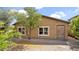 Nice backyard with mature trees, desert landscaping, pavers, and a rear patio at 17132 W Tara Ln, Surprise, AZ 85388