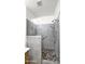 Modern bathroom features a pebble-stone shower floor and handicap-accessible grab bars at 17132 W Tara Ln, Surprise, AZ 85388
