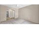 Spacious bedroom featuring a neutral carpet, fresh paint and access to a bathroom at 17132 W Tara Ln, Surprise, AZ 85388
