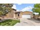 Charming single-Gathering home with a two-car garage and stone accents on a sunny day at 17132 W Tara Ln, Surprise, AZ 85388