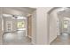 Inviting foyer with gray tile flooring and arched doorways, leading to living areas at 17132 W Tara Ln, Surprise, AZ 85388
