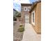 Close up of front door with decorative security door and stone siding at 17132 W Tara Ln, Surprise, AZ 85388