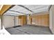 Spacious two-car garage features built-in wooden storage and durable flooring at 17132 W Tara Ln, Surprise, AZ 85388