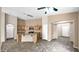 Open kitchen with a center island, stainless steel appliances, and tiled floors at 17132 W Tara Ln, Surprise, AZ 85388