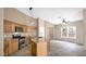 Well-equipped kitchen with stainless steel appliances, granite countertops, and wood cabinetry at 17132 W Tara Ln, Surprise, AZ 85388