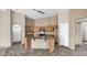Bright kitchen featuring an island, granite counters, updated appliances and lovely pendant lights at 17132 W Tara Ln, Surprise, AZ 85388