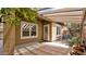Charming covered patio featuring brick pavers and a tranquil outdoor space at 17132 W Tara Ln, Surprise, AZ 85388