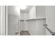 Bright walk-in closet with mirror features multiple shelves and ample space at 17132 W Tara Ln, Surprise, AZ 85388