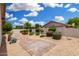 Large backyard features desert landscaping, a brick paver patio, and desert landscaping for easy maintenance and beautiful appeal at 19029 N 36Th St, Phoenix, AZ 85050