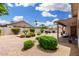 Expansive backyard featuring desert landscaping, paver patio and low walls with bushes for privacy, offering a serene outdoor space at 19029 N 36Th St, Phoenix, AZ 85050