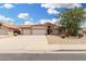 Inviting single-story home featuring a two-car garage and desert landscaping at 19029 N 36Th St, Phoenix, AZ 85050