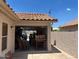 Open garage with exterior view featuring a tiled roof, and a stucco wall at 19029 N 36Th St, Phoenix, AZ 85050