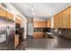 Bright kitchen featuring stainless steel appliances, wooden cabinets, and ample counter space at 19029 N 36Th St, Phoenix, AZ 85050