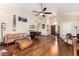 Bright living room featuring hardwood floors, a ceiling fan, and neutral paint at 19029 N 36Th St, Phoenix, AZ 85050