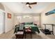 Large main bedroom featuring a ceiling fan, carpeted floors, neutral wall paint, and natural light at 19029 N 36Th St, Phoenix, AZ 85050