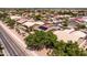 This aerial view shows the property's solar panels, refreshing pool and established landscaping at 1932 S Arroyo Ln, Gilbert, AZ 85295