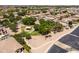An aerial view highlights a neighborhood park, featuring a shaded playground area and mature trees at 1932 S Arroyo Ln, Gilbert, AZ 85295