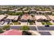 A house with great curb appeal stands out in this beautiful aerial view of the entire neighborhood at 1932 S Arroyo Ln, Gilbert, AZ 85295