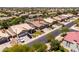 An aerial view shows a well landscaped home in a neighborhood with other beautiful properties at 1932 S Arroyo Ln, Gilbert, AZ 85295