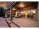 Covered patio with comfortable seating and seamless access to the home's interior at 1932 S Arroyo Ln, Gilbert, AZ 85295