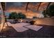 Beautifully landscaped backyard featuring a pool, illuminated walkway, and privacy wall for ultimate relaxation and enjoyment at 1932 S Arroyo Ln, Gilbert, AZ 85295