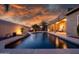 Expansive backyard featuring a stunning pool with a water feature, perfect for outdoor gatherings and leisure time at 1932 S Arroyo Ln, Gilbert, AZ 85295