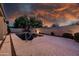Relax in the privacy of this backyard oasis, complete with a sparkling pool, lush landscaping, and tranquil water feature at 1932 S Arroyo Ln, Gilbert, AZ 85295