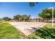 A basketball court is conveniently located near shaded picnic areas and walking paths in the neighborhood park at 1932 S Arroyo Ln, Gilbert, AZ 85295