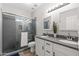 Modern bathroom with a tiled shower, dual sinks, and sleek fixtures at 1932 S Arroyo Ln, Gilbert, AZ 85295