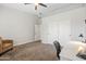 Neutral bedroom with closet, ceiling fan, and carpeted floor offers comfortable living space at 1932 S Arroyo Ln, Gilbert, AZ 85295