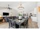 Open-concept dining area connected to the kitchen and living room, featuring wood-look floors at 1932 S Arroyo Ln, Gilbert, AZ 85295