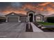 Charming single-Gathering home with a large, well-maintained front yard and a three car garage at 1932 S Arroyo Ln, Gilbert, AZ 85295